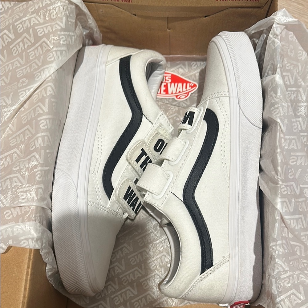 Vans White and Black Sneakers with Classic Design